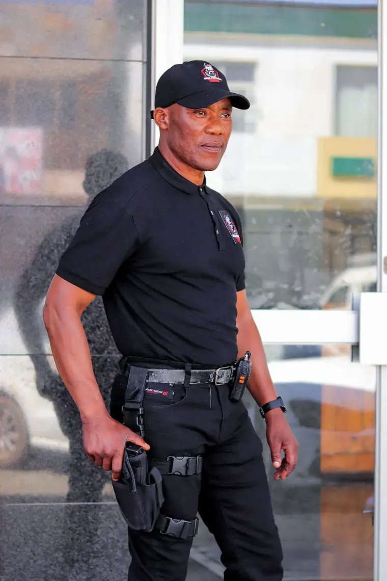Nsika Protection Services officer in branded uniform and duty belt on shift